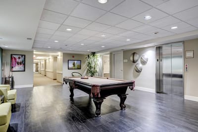 Interior view of a common area with a billiards table
