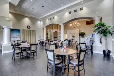 Bright common area with dining tables and decor