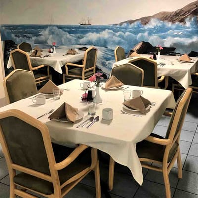 Dining area with tables set for meals