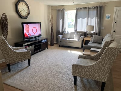 Cozy common area with seating and television