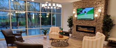 Interior common area with seating and a television