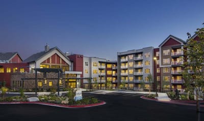 Exterior view of the assisted living facility at dusk