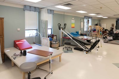 Physical therapy room with rehabilitation equipment