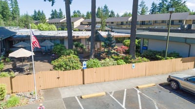 Outdoor space with gardens and seating in a senior living facility