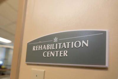 Sign for the Rehabilitation Center inside a facility