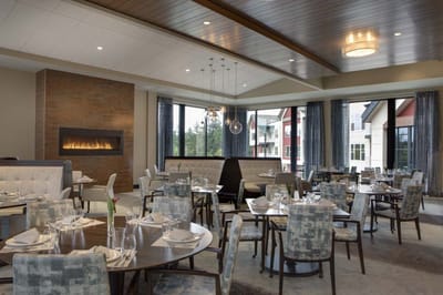 Elegant dining room setup in a senior living facility
