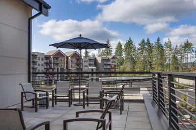 Outdoor patio area with seating and umbrellas