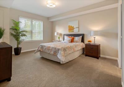 Bright, cozy bedroom with a bed and decor