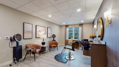 Salon area with stylish seating and hair styling stations.
