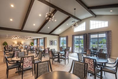 Dining area with tables and chairs in a well-lit room