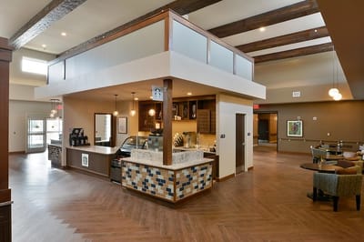 Interior common area with seating and a service counter.