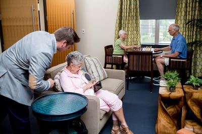 Residents engaging in activities in a common area.
