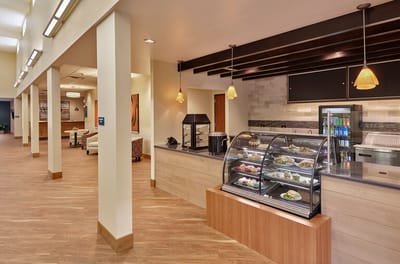 Dine-in area featuring a food display and seating.