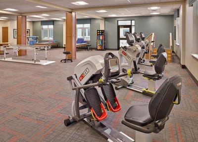Rehabilitation equipment in a therapeutic exercise room.
