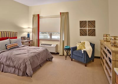 Cozy resident bedroom with decor.