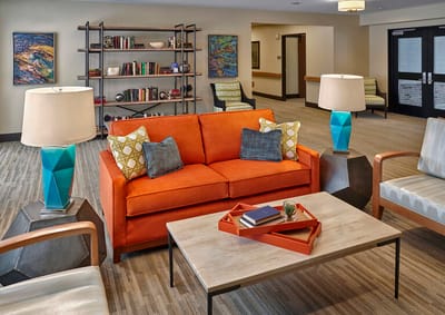 Bright interior common area with colorful furniture.