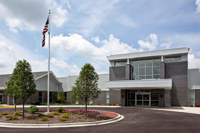 Exterior view of the facility with landscaping