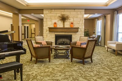 Cozy common area with seating and fireplace.