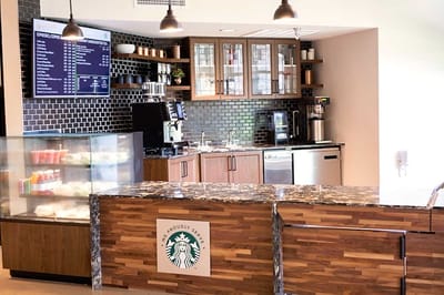 Coffee bar area with a logo