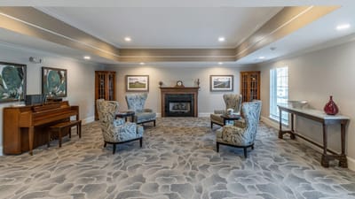 Interior common area with seating and a piano