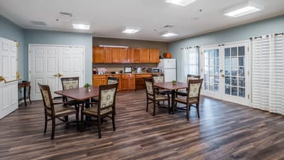 A bright dining area with tables and chairs