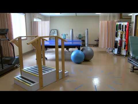 Physical therapy room equipped with exercise equipment