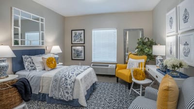 Brightly decorated resident bedroom with modern furnishings