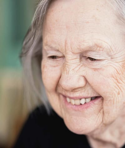 Close-up of an elderly woman smiling