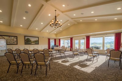 Bright interior activity room with chairs and natural light