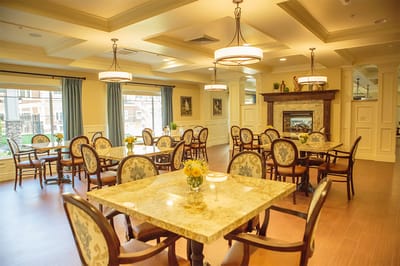 Bright dining area with tables and floral arrangements