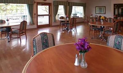 Bright and spacious common area with wooden floors