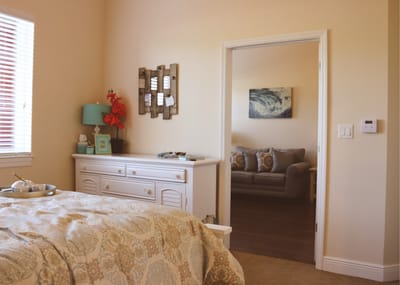 Cozy private resident room with a bed and couch