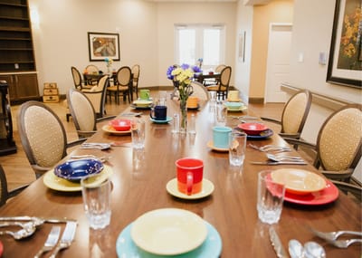 Dining room set with colorful table settings