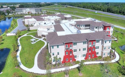 Aerial view of Promise Pointe Senior Living building and grounds