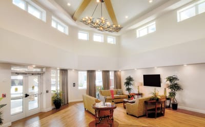 Bright and welcoming common area with seating and plants