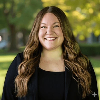 Staff member smiling in outdoor setting
