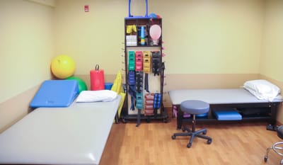 Therapy room with equipment and mats