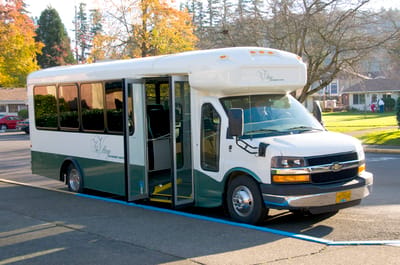 Facility shuttle bus parked outside