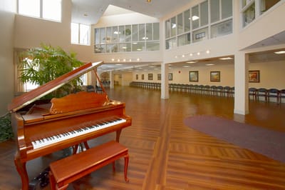 Interior view of a social space with a piano