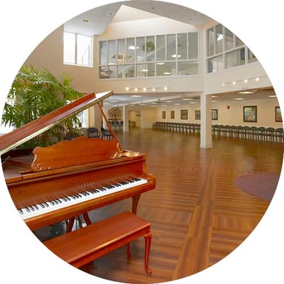 Interior view showcasing a grand piano and seating area.