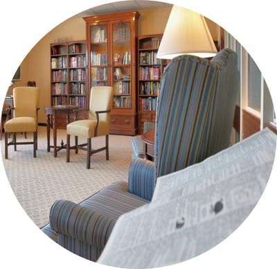 Cozy reading area with bookshelves and seating.