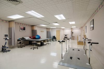 Rehabilitation room with equipment and therapy area
