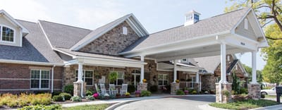 Exterior view of Bickford of Carmel with flowers and seating
