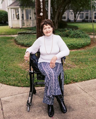 A resident enjoying the outdoors in a wheelchair
