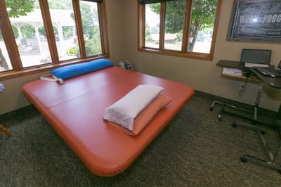 Interior view of a room with a large bed and desk