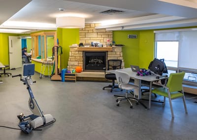 Spacious activity room with fitness equipment and colorful decor