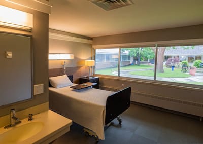 Bright resident room with a view of an outdoor space