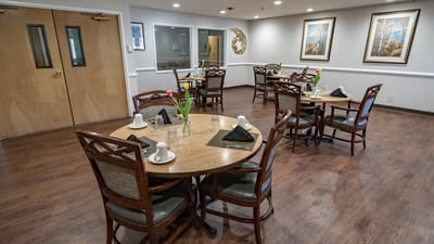 Dining area with tables set for residents
