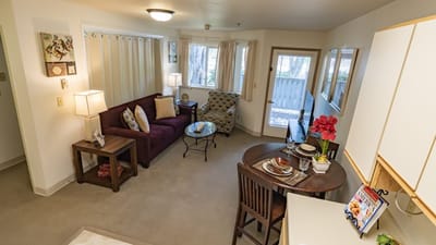 Cozy living space with a sofa and dining area