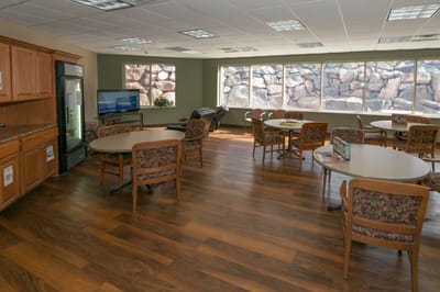 Bright common area with tables and chairs